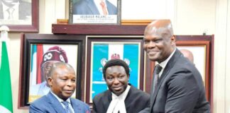 The Honourable Attorney-General of the Federation and Minister of Justice, Prince Lateef Fagbemi SAN, receiving the Report from the Facilitator of the Working Group on the Legal Status of Inmates in Correctional Centres, Olawale Fapohunda (SAN) on Wednesday 19th March, 2025 in Abuja.