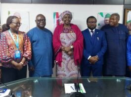 Group Photograph: Official Inauguration Ceremony of PMTCT-TWG members Middle: Permanent Secretary Daju Kachollom mni; on her right: Dr. Michael Akpan Director Port Health Services Division, representing the Director Public Health Dept. & Chair PMTCT- TWG; left of Permanent Secretary: Dr. Adebobola Adebashorun Director National Coordinator NASCP & Vice-Chair PMTCT-TWG; supported by other members