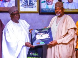 Receiving a plaque from the President, NABG, Arch Kabiru Ibrahim (L), to the Hon Minister of Agriculture and Food Security, Sen Abubakar Kyari (R), during the courtesy visit in Abuja.