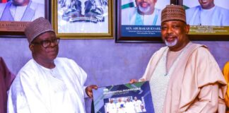 Receiving a plaque from the President, NABG, Arch Kabiru Ibrahim (L), to the Hon Minister of Agriculture and Food Security, Sen Abubakar Kyari (R), during the courtesy visit in Abuja.