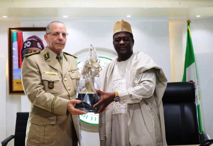 Algerian War College LtoR, Permanent Secretary, Federal Ministry of Art, Culture, Tourism and Creative Economy Dr Mukhtar Muhammad, Presenting a Gift to General Baouche Amrouche of Algeria War College