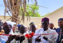 The Honourable Minister of State for Health Social & Welfare Dr. Iziaq Adekunle Salako commissioning the Molecular Laboratory facility at the Hospital. Supported by Dr. Salaudeen Jimoh mni Director Hospital Services Department FMoH SW (Middle) and, Bishop of Diocese of Sokoto, Dr. Mathew Hassan Kukah.