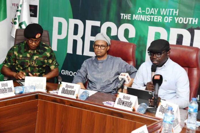 International Day of the Boy-Child First from the right is Hon. Minister of Youth Development, Comrade Ayodele Olawande, 2nd right is Permanent Secretary, Federal Ministry of Youth Development, Mr Olubunmi Olusanya, 1st from left is Director General of the NYSC, Brig. Gen.Olakunle Oluseye seated as Mentors to commemorate this year's International Day of the Boy-Child in his Office in Abuja.