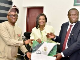 L-R: Director-General, Bureau of Public Procurement (BPP) Dr. Adebowale A. Adedokun, MCIPS, ACFE presenting a souvenir to President, Chartered Institute of Logistics and Transportation, Amb. Anthonia Ekpa while the Chairman, FCT Chapter of the Institute, Dr. Emmanuel onwudi assisted her during the courtesy visit by the CILT to the Bureau in Abuja