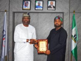 From left: Hon. Kolade Daniel Abimbola receiving a memorabilia from the FIRS Chairman Dr. Zacch Adedeji.