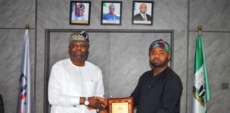 From left: Hon. Kolade Daniel Abimbola receiving a memorabilia from the FIRS Chairman Dr. Zacch Adedeji.