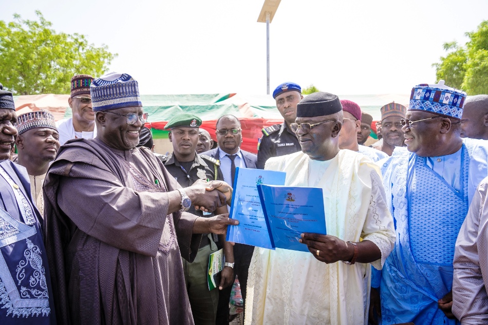 Official signing of documents and handover of the facility by the Honourable Minister of Water Resources and Sanitation, Engr. Prof. Joseph Terlumun Utsev (2ndR) to the Representative of Yobe State Governor, Deputy Governor Hon. Idi Barde Gubana(Left)