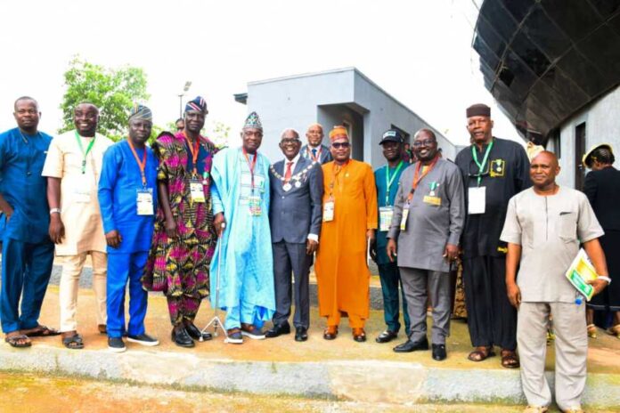 AGM 7th from Left : Reprentative of Surveyor General of the Federation Sur Semiu Ayinde , on his left is NIS,President Matthew O Ibitoye and others in a group picture shortly after the opening ceremony