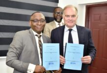 L-R: Director-General, Bureau of Public Procurement (BPP) Dr. Adebowale A. Adedokun, FCIPS, ACFE, and the Chief Executive Officer, Chartered Institute of Procurement and Supply (CIPS) UK, Mr. Ben Farrel displaying copies of Memorandum of Understanding (MoU) signed by the BPP and CIPS during the CIPS Team visit to BPP in Abuja