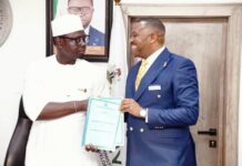 L-R The Honourable Minister, Comrade Ayodele Olawande, and the representative of Investonaire Academy, Dr. Enefola Odiba, at the signing ceremony of the MoU to train Nigerian youth in Forex trading.
