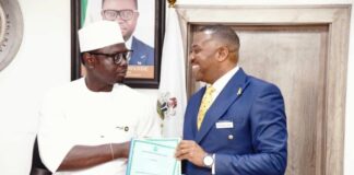L-R The Honourable Minister, Comrade Ayodele Olawande, and the representative of Investonaire Academy, Dr. Enefola Odiba, at the signing ceremony of the MoU to train Nigerian youth in Forex trading.