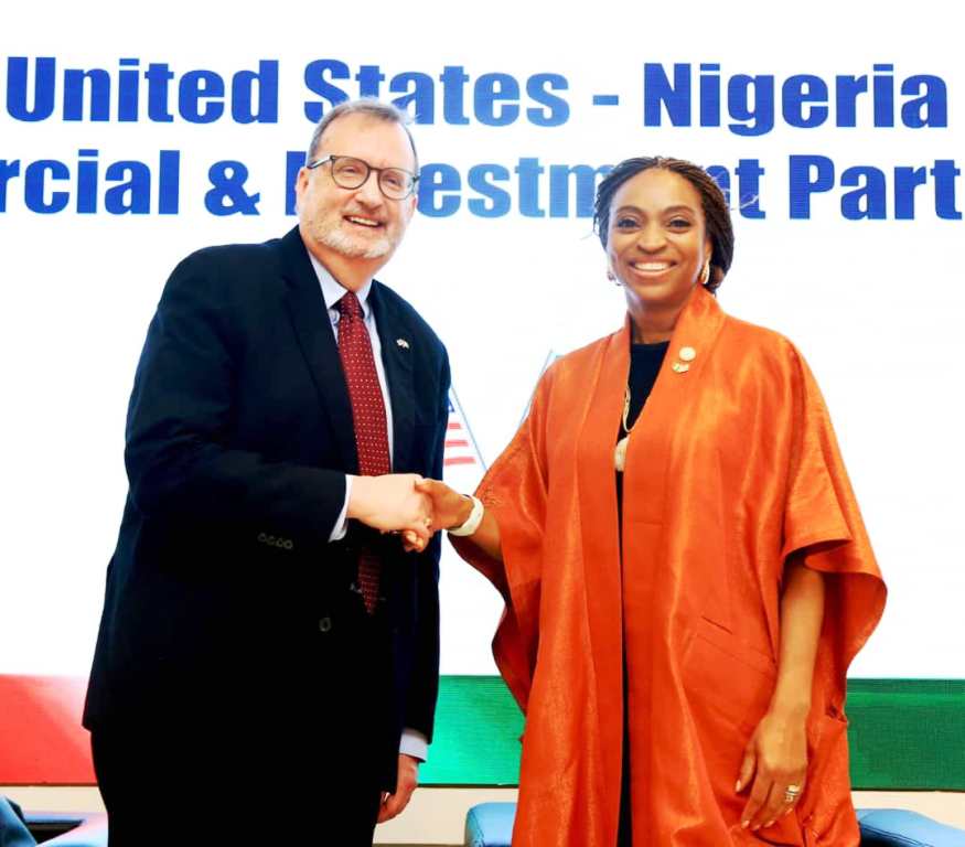 The Hon. Min. of Trade & Investment, FMITI, Dr. Jumoke Oduwole MFR, in a handshake with the US ambassador to Nigeria, Amb. Richard M. Mills Jr. during the United States - Nigeria Commercial & Investment Partnership Working Group Launch in Abuja on Tuesday 24th June 2025.