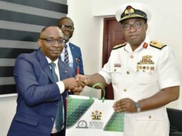 L-R: Director-General, Bureau of Public Procurement (BPP) Dr. Adebowale A. Adedokun, FCIPS, ACFE presenting a souvenir to the Commandant, Nigerian Navy Logistics College, NNLC, Rear Admiral EC Anakwe during his visit to BPP