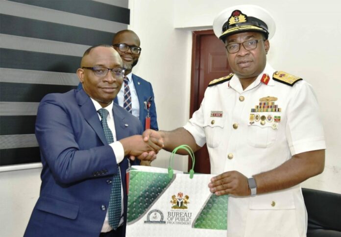 Nigerian Navy Logistics College On A Working Visit L-R: Director-General, Bureau of Public Procurement (BPP) Dr. Adebowale A. Adedokun, FCIPS, ACFE presenting a souvenir to the Commandant, Nigerian Navy Logistics College, NNLC, Rear Admiral EC Anakwe during his visit to BPP