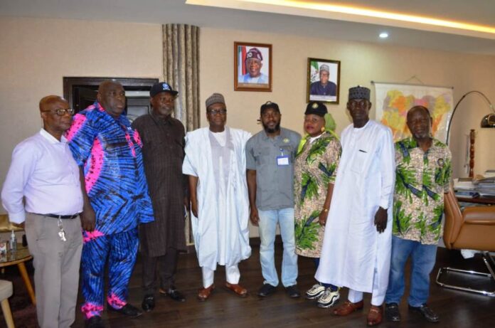 RMAFC Chairman 4th from L: RMAFC Chairman, Dr. Mohammed Bello Shehu OFR; 5th L: Newly Elected Chairman, NSCU RMAFC Chapter, Comrade Mohammed Rabiu Enagi; 6th L: Rep of the National Chairman, Comrade Ganiyat Adeogun and other Union Members at the RMAFC Headquarters, Abuja