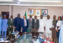 The Hon. Minister of State for Industry, FMITI, Sen John Owan Enoh(middle), The Executive Secretary, National Sugar Development Council (NSDC), Kamar Bakri (sixth left), the Chaireman, Golden Sugar Refinery, John Coumantaros (fifth left), the Managing Director, Bua Group, Ayodele Abioye (fourth left) and other stakeholders in a group photograph at the meeting on the backward Integration of sugar production in Abuja.