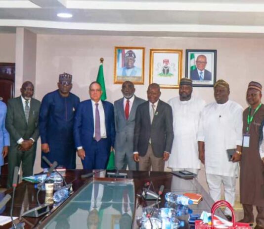 The Hon. Minister of State for Industry, FMITI, Sen John Owan Enoh(middle), The Executive Secretary, National Sugar Development Council (NSDC), Kamar Bakri (sixth left), the Chaireman, Golden Sugar Refinery, John Coumantaros (fifth left), the Managing Director, Bua Group, Ayodele Abioye (fourth left) and other stakeholders in a group photograph at the meeting on the backward Integration of sugar production in Abuja.
