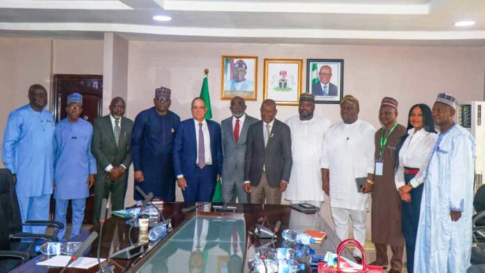 The Hon. Minister of State for Industry, FMITI, Sen John Owan Enoh The Hon. Minister of State for Industry, FMITI, Sen John Owan Enoh(middle), The Executive Secretary, National Sugar Development Council (NSDC), Kamar Bakri (sixth left), the Chaireman, Golden Sugar Refinery, John Coumantaros (fifth left), the Managing Director, Bua Group, Ayodele Abioye (fourth left) and other stakeholders in a group photograph at the meeting on the backward Integration of sugar production in Abuja.