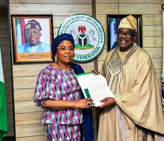 The Head of the Civil Service of the Federation, Mrs Didi Esther Walson-Jack, OON, mni, receiving the draft Nigerian Public Service Writing Style Manual and the Committee report, from the Chairman, Mr. Olusade Adesola, OON, (Rtd Former Permanent Secretary) on Friday, 30th May, 2025, in Abuja.