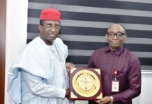 Right: Director-General, Bureau of Public Procurement (BPP) Dr. Adebowale A. Adedokun, FCIPS, ACFE, receiving a plaque from the President, Nigerian Institute of Quantity Surveyors (NIQS), Qs, Kene Nzekwe, FNIQS, during his visit to BPP office in Abuja