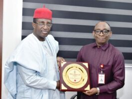 Right: Director-General, Bureau of Public Procurement (BPP) Dr. Adebowale A. Adedokun, FCIPS, ACFE, receiving a plaque from the President, Nigerian Institute of Quantity Surveyors (NIQS), Qs, Kene Nzekwe, FNIQS, during his visit to BPP office in Abuja