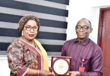 Right: Director-General, Bureau of Public Procurement (BPP) Dr. Adebowale A. Adedokun, FCIPS, ACFE, receiving a plaque from the President, Nigerian Society of Engineers (NSE), Engr. Margaret Aina Oguntala, FNSE, during her visit to BPP in Abuja
