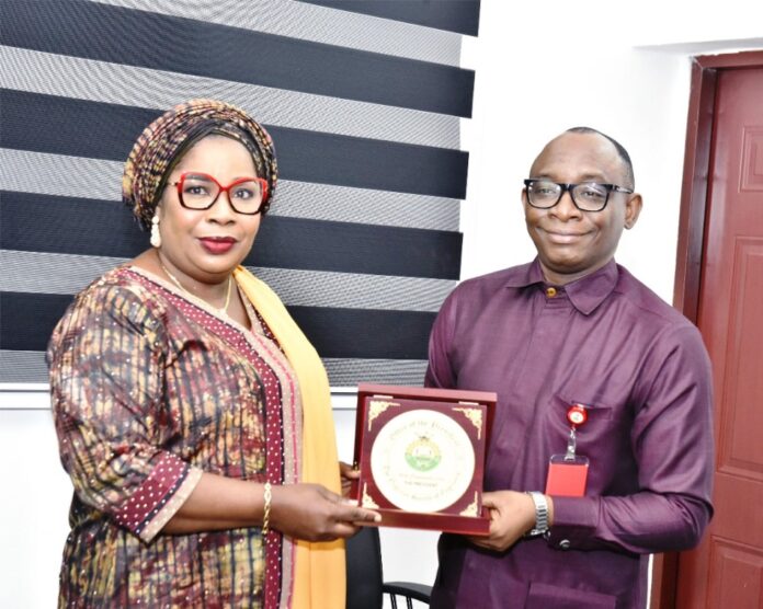 Director-General BPP Advises NSE Right: Director-General, Bureau of Public Procurement (BPP) Dr. Adebowale A. Adedokun, FCIPS, ACFE, receiving a plaque from the President, Nigerian Society of Engineers (NSE), Engr. Margaret Aina Oguntala, FNSE, during her visit to BPP in Abuja