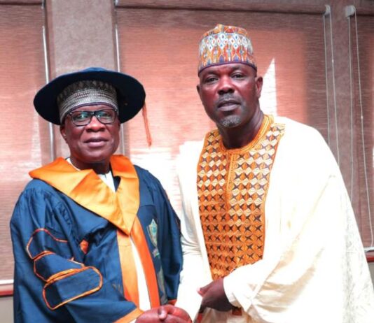 The Hon. Minister, Ministry of Regional Development, Engr. Abubakar Momoh being conferred with the prestigious "Excellent Leadership Award" and "Professional Doctorate Fellowship Award" by the Executive Secretary/ National Coordinator of the Institute of Professional Economists and Management Policy, Dr. Musa Aliu Yakub Okhumeode, in his Office, Abuja.