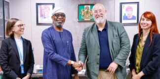 Minister of Solid Minerals Development, Dr. Dele Alake, in a warm handshake with Project Co-ordinator, United Nations Office of Drugs and Crime, Mr.Tom Parker. With them are project officers Nicole Anderson (left) and Inneke Geysens- Bourgions, ((right)