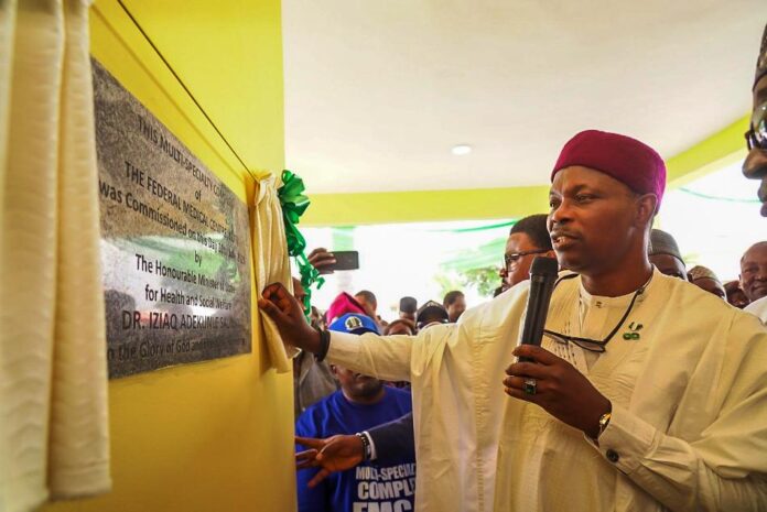Dr. Iziaq Adekunle Salako Honourable Minister of State for Health & Social Welfare drawing the curtain on the plaque Commissioning the Multi-Specialty Complex of the Federal Medical Centre Keffi Nasarawa State.