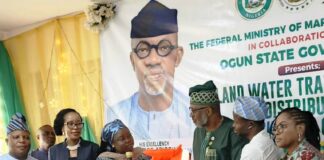 Director Maritime Services, Federal Ministry of Marine and Blue Economy, Dr. Mercy Ilori (l), presents the life jacket to the Ogun State Commissioner fir Transportation, Engr. Gbenga Dairo at Abeokuta.