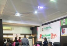 Pharmacist (Mrs)Olubunmi Aribeana reading the Keynote address of the Honourable Coordinating Minister of Health and Social Welfare Professor Muhammad Ali Pate at the Ministerial Press Briefing, marking the Maiden National Self-Care Day 2025.