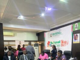 Pharmacist (Mrs)Olubunmi Aribeana reading the Keynote address of the Honourable Coordinating Minister of Health and Social Welfare Professor Muhammad Ali Pate at the Ministerial Press Briefing, marking the Maiden National Self-Care Day 2025.