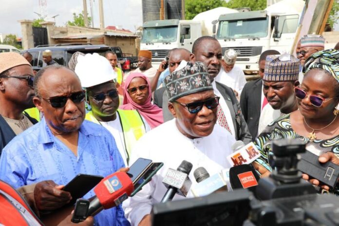 NEDC Projects In Borno3 The Minister, Regional Development, Engr. Abubakar Momoh, (middle), addressing news men during a working visit to Borno State on his impression of NEDC projects in the State.