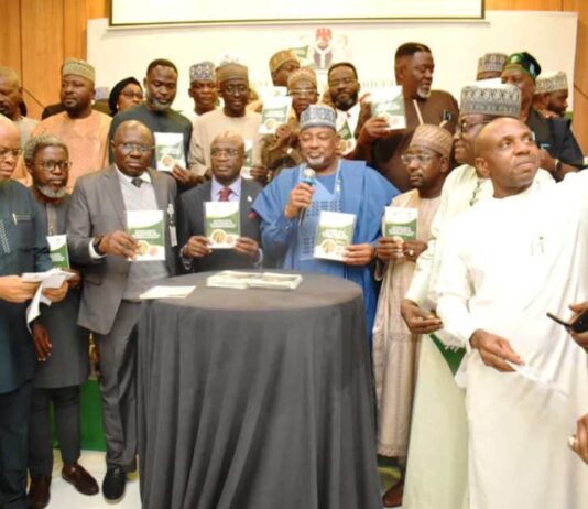The Minister of Agriculture and Food Security, Sen Abubakar Kyari (C), and other stakeholders during the launch.