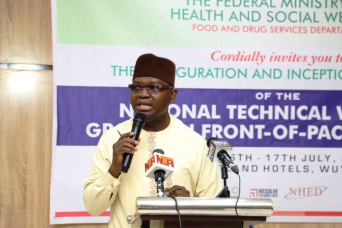 The Permanent Secretary Federal Ministry of Health & Social Welfare Daju Kachollom mni, represented by Dr. Dogara Okara Senior Technical Assistant to the Permanent Secretary, delivering the keynote address during the opening ceremony of the Inauguration & Inception of the National Technical Working Group on Front - of- Pack Labelling programme - organized by the Food & Drug Services Department of Federal Ministry of Health & Social Welfare.