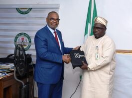 L-R : The former General Manager of Shell Group and the current Group Managing Director of the Nembe Exploration and Production Company Limited Ike Okoronkwo presenting his company gift to Surveyor General of the Federation (SGOF) Abduganiyu Adeyemi Adebomehin during his visit