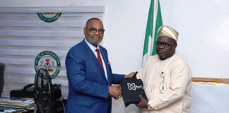 L-R : The former General Manager of Shell Group and the current Group Managing Director of the Nembe Exploration and Production Company Limited Ike Okoronkwo presenting his company gift to Surveyor General of the Federation (SGOF) Abduganiyu Adeyemi Adebomehin during his visit