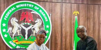The Honourable Minister of Marine and Blue Economy, His Excellency Adegboyega Oyetola, CON (left) receiving a presentation from the Acting President, Fisheries Cooperative Federation of Nigeria (FCFN), Mr. Mashi Gabriel Sani, at an interactive session with fisheries cooperatives groups in Abuja on Wednesday.