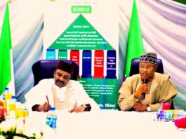 L-R, the Hon. Minister of Transportation, sen. Said Ahmed Alkali, noting the request his quest, the Governor of Kaduna state sen. Uba Sani was making to enable him to respond to the Governor.