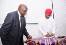 Hon. Minister of Innovation, Science and Technology (FMIST), Chief Uche Geoffrey Nnaji, Signing the Memorandum of Understanding (MoU) Between the Ministry and (COREN), (COMEG) (CORBON) and Tectonics Engineering Group-Consultant, with him Director, Legal Services FMIST, Mr. Obi Agusiobo (left) at the Signing of Memorandum of Understanding (MoU) Between the Ministry and (COREN), (COMEG) (CORBON) and Tectonics Engineering Group-Consultant, in Abuja, today.