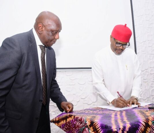 Hon. Minister of Innovation, Science and Technology (FMIST), Chief Uche Geoffrey Nnaji, Signing the Memorandum of Understanding (MoU) Between the Ministry and (COREN), (COMEG) (CORBON) and Tectonics Engineering Group-Consultant, with him Director, Legal Services FMIST, Mr. Obi Agusiobo (left) at the Signing of Memorandum of Understanding (MoU) Between the Ministry and (COREN), (COMEG) (CORBON) and Tectonics Engineering Group-Consultant, in Abuja, today.