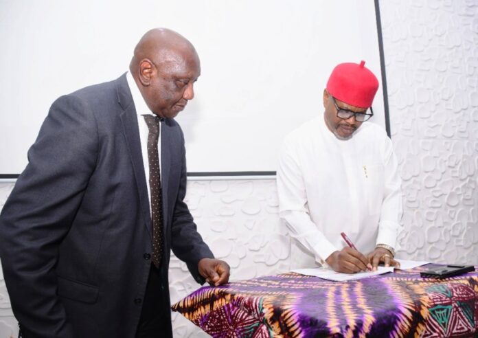 Use Of Substandard Materials For Infrastructure Hon. Minister of Innovation, Science and Technology (FMIST), Chief Uche Geoffrey Nnaji, Signing the Memorandum of Understanding (MoU) Between the Ministry and (COREN), (COMEG) (CORBON) and Tectonics Engineering Group-Consultant, with him Director, Legal Services FMIST, Mr. Obi Agusiobo (left) at the Signing of Memorandum of Understanding (MoU) Between the Ministry and (COREN), (COMEG) (CORBON) and Tectonics Engineering Group-Consultant, in Abuja, today.