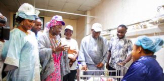 Inspection Tour of Postnatal ward, National Hospital Abuja. Mrs. Ladidi Bako-Aiyegbusi leading the delegation, addressing a Breastfeeding mother.