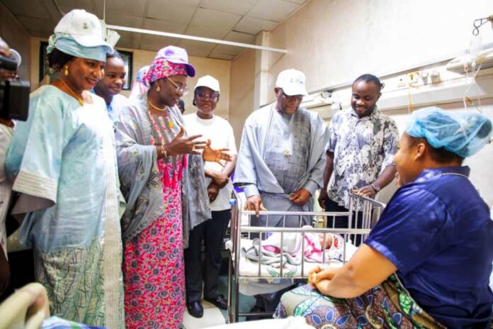 2025 World Breastfeeding Week Inspection Tour of Postnatal ward, National Hospital Abuja. Mrs. Ladidi Bako-Aiyegbusi leading the delegation, addressing a Breastfeeding mother.