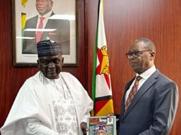 NTAC DG, Rt. Hon. Yusuf Buba Yakub,* as he presents the NTAC in-house Magazine, *DatelineNTAC* to the Zimbabwe's Minister of Health and Child Care, Dr. Douglas T. Mombeshora during a visit to the Ministry by a delegation led by the DG on Wednesday, August 6, 2025.