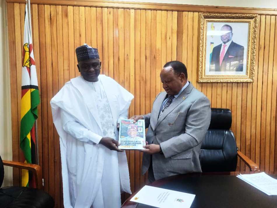 Rt. Hon. Yusuf Buba Yakub,* Director General, Nigerian Technical Aid Corps, as he offers a souvenir, a copy of *DatelineNTAC* in-house Publication of the Corps, to the Honourable Minister of Secondary and Primary Education of Zimbabwe, Dr. Torerayi Moyo, during a courtesy visit by the NTAC boss to the latter in Harare on Wednesday, August 6, 2025.