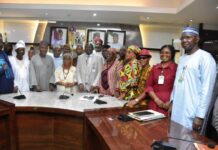 The Permanent Secretary of the Ministry, Dr Marcus Olaniyi Ogunbiyi (C), and members of the Committee during the Inauguration.