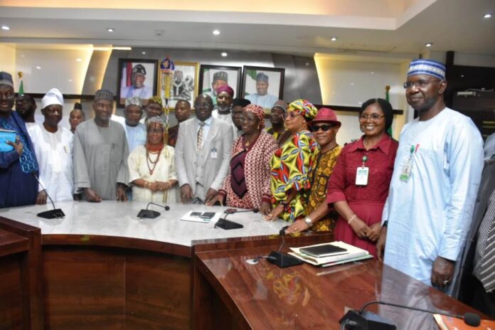 The Permanent Secretary of the Ministry, Dr Marcus Olaniyi Ogunbiyi (C), and members of the Committee during the Inauguration.