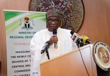 The Hon. Minister, Ministry of Regional Development, Egnr. Abubakar Momoh delivering his speech during the inauguration of the newly appointed Governing Boards and Management Teams of the North Central, South South and South West Deplopment Commissions, performed today 28th August, 2025 in Abuja
